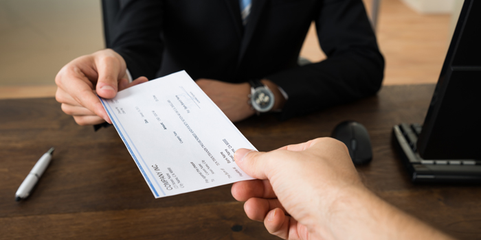 Person is receiving a check.